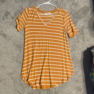 Very stretchy, soft, and long yellow and white shirt.